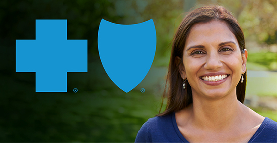 Woman smiling next to Blue Cross Blue Shield logo