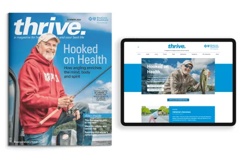 The Thrive magazine and the Thrive webpage on a tablet.