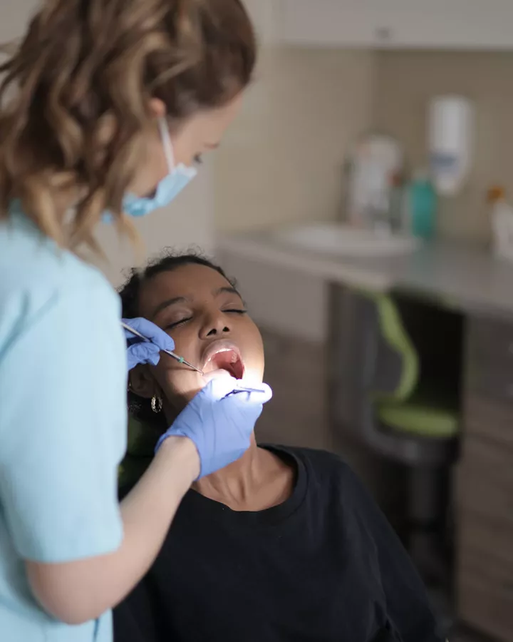 Dentist examining a child's mouth.